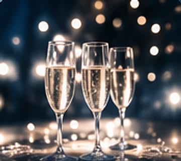 Champagne glasses in soft light.