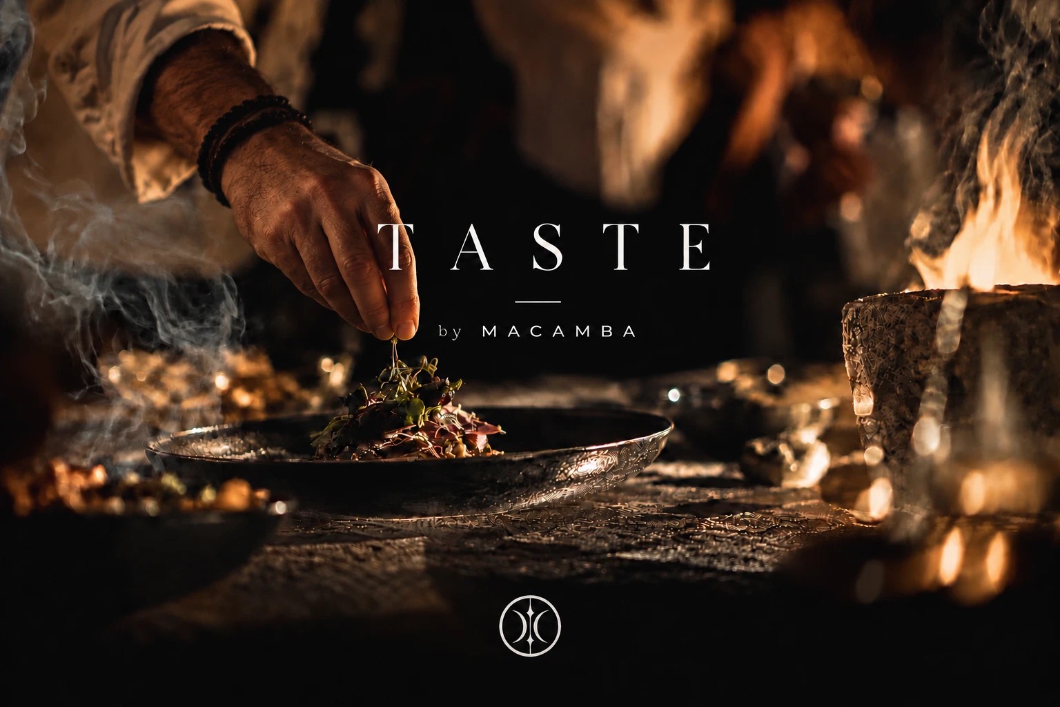 TASTE by MACAMBA. A hand finishing a dish over a dark table lit by open fire, small plates and glasses around it, the ICE symbol beneath.
